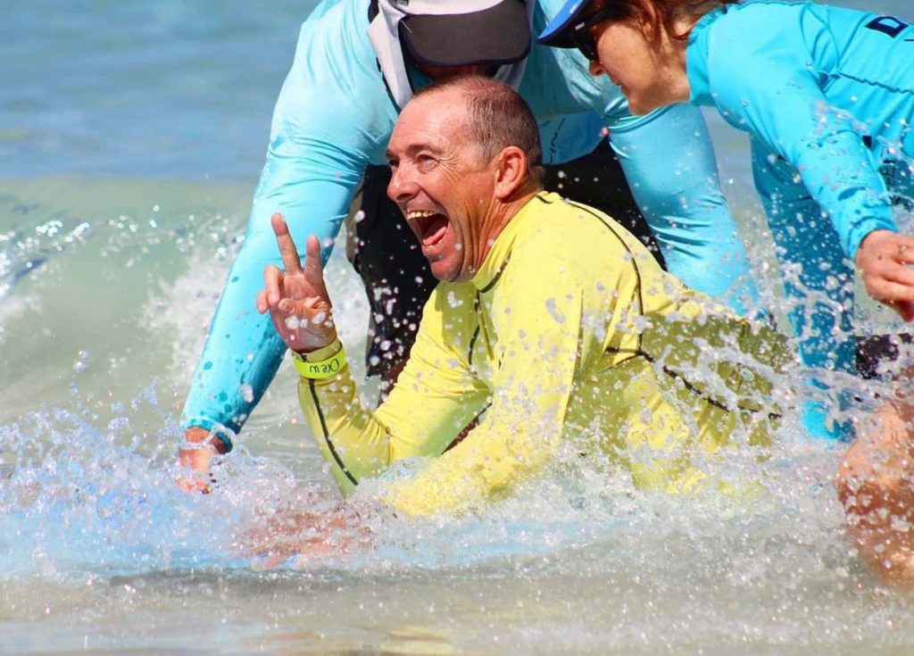 Man smiling in surf