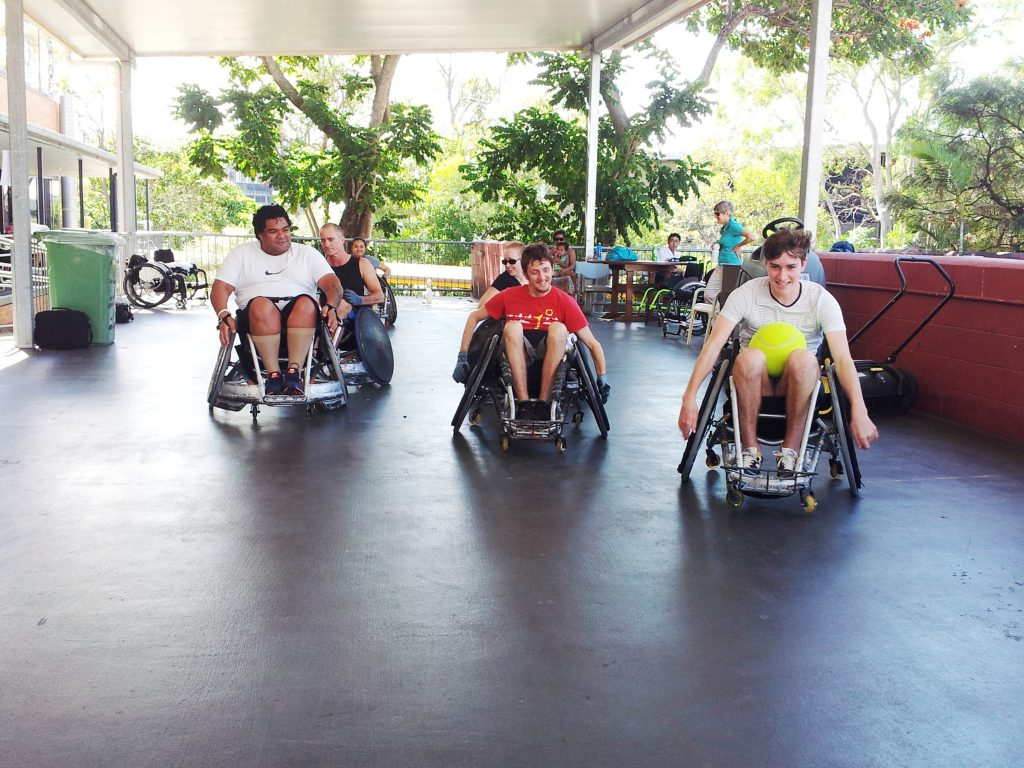 People in wheelchairs playing sport